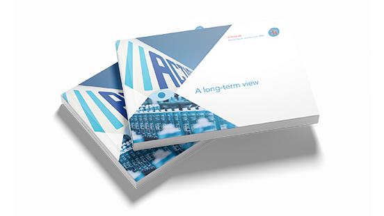 Stack of annual reports, with a cover showing 'A long-term view'