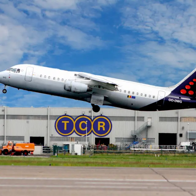 Brussels Airlines plane taking off near TCR ground equipment